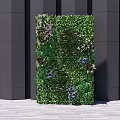 Modern Green Plant Wall With Lush Greenery Purple Flowers And Black Columns