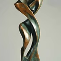 Abstract Metallic Sculpture Carving With Curved Flowing Lines And Bronze Greenish Finish