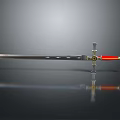 Medieval Sword With Metallic Blade Red Handle And Golden Cross Guard On Black Background