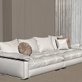 White Sectional Sofa with Plush Cream and Brown Pillows in Modern Living Room