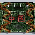 Artistic Landscape Wall With Green Orange Plants And Red Chinese Characters Design