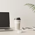 Open Laptop On Desk With Coffee Cup Magazine Mouse And Green Plant Leaf