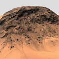 Stunning Desert Landscape With Main Rocky Hill and Vast Sandy Terrain in Orange Brown Hues