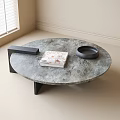 Round Grey Marble Coffee Table With Black Legs And Decorative Items 3d model