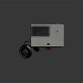 Desktoport Electronic Device With Red Knob Black Vents Lens Power Cable And Plug