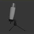 Silver Microphone With Mesh Grille On Tripod Stand For Household Daily Use