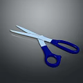 Metal Blade Scissors With Blue Handles On Smooth Surface For Daily Use