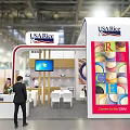 USA Rice Exhibition Booth With Chef Preparing Food And Customer At Counter