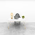 Modern White Desk Black Chair With Gold Legs Lamp Laptop And Green Plant