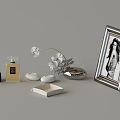 Stylish Daily Living Accessories Featuring Perfume Bottles White Flower Stones And Photo Frame