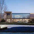 Modern Sales Office Building Architecture With Glass Curtain Wall And Landscaped Garden Featuring Trees And Lighting