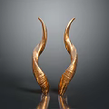 Artistic Golden Curved Textured Sculptures On Black Surface With Reflections