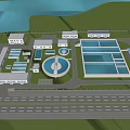 Industrial Factory Complex With Multiple Buildings Circular Facility Surrounding Green Vegetation River And Road