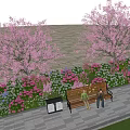 Floral Garden With Pink Blossom Trees Colorful Flowers And Bench With People Sitting