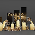 Floral Installation for Fashion Show with Gold Black Columns and Decorative Elements