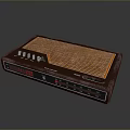 PC Accessory Device With Brown Casing Orange Grill Pattern Buttons And Interface Ports