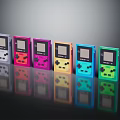 Retro Handheld Game Consoles In Various Colors Arranged In A Row Showcase