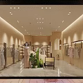 Elegant Clothing Storefront with Modern Window Display Mannequins Green Plants and Lighting