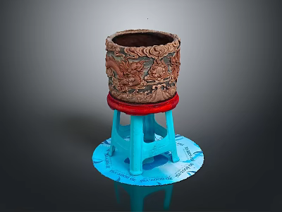 Carved Brown Container With Red Base On Blue Stool Shaped Stand 3d model