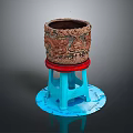 Carved Brown Container With Red Base On Blue Stool Shaped Stand