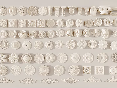 Collection Of White Carved Decorative Pieces With Floral Circular And Geometric Patterns 3d model