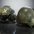 Two Worn Green Helmets With White Cross Marking On Dark Reflective Surface