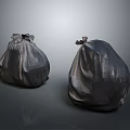 Two Black Tied Plastic Trash Bags For Household Waste Disposal
