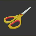 Yellow Scissors With Red Grip Handles And Shiny Metal Blades On Dark Surface