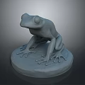 Gray Frog Sculpture Sitting On Round Base With Detailed Legs Decorative Ornament