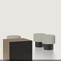 Three Elegant Plush Stools with Dark Cylindrical Legs Against Light Background