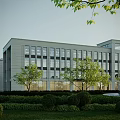 Modern Beige Office Building With Large Glass Windows And Landscaped Trees Shrubs