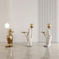 Golden And White Bear Sculptures Holding Tray With Balloon In Modern Interior