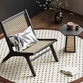 Stylish Wicker Chair With Patterned Cushion Round Rug Side Table And Tea Set