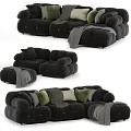 Soft Black Sectional Sofa With Plush Pillows Ottoman And Cozy Blanket