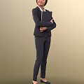 Woman in Dark Professional Suit Standing with Arms Crossed Over Chest Against Beige Background