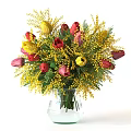 Transparent Glass Vase With Yellow Mimosa And Red Pink Tulip Flowers