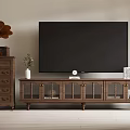 Classic Wooden TV Stand With Glass Doors And Decorative Items Like Books Clock And Plant
