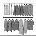Clothes Hanging On Hangers Arranged In Rows With Various Styles And Stripes