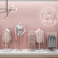 Retail Display Shelves With Mannequin Hanging Clothes Folded Apparel And Neon Sign On Pink Wall