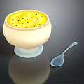 Creamy Yellow Pudding Dessert Topped with Black Seeds in White Bowl and Spoon
