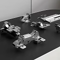 Various Stainless Steel Hardware Components Including Hinges On Black Surface