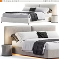Modern Double Bed With Upholstered Headboard White Linens And Striped Pillows