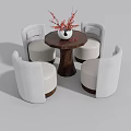 Comfortable White Leisure Chairs Around Round Wooden Table With Red Flower Vase