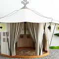 White Tent with Decorative Top Beige Curtains Round Carpet and Lanterns in Outdoor Green Area