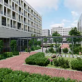 Modern Pergola In Courtyard With Green Trees Red Brick Pavement And Modern Buildings