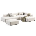 Modern Sectional Sofa Set With Grey White Upholstery Pillows Blankets And Ottoman
