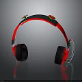 Red And Black Over Ear Headphones With Green Accents And White Wire Reflective Design