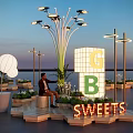 Outdoor Dessert Display Area With Illuminated SWEETS Sign Decorative Lights And Evening Sky Setting