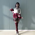 Woman Posing in Red White Sweater Plaid Skirt Burgundy Thigh High Socks Gray Wall Background