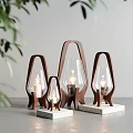 Modern Wooden Frame Table Lamps With Glass Shades In Various Sizes On Gray Tabletop